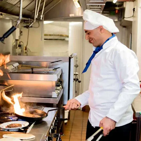 Bear Hollow Estates Chef Created Meals, chef frying a dish.